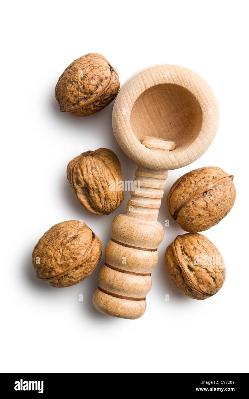 wooden nutcracker and walnuts on white background Stock Photo