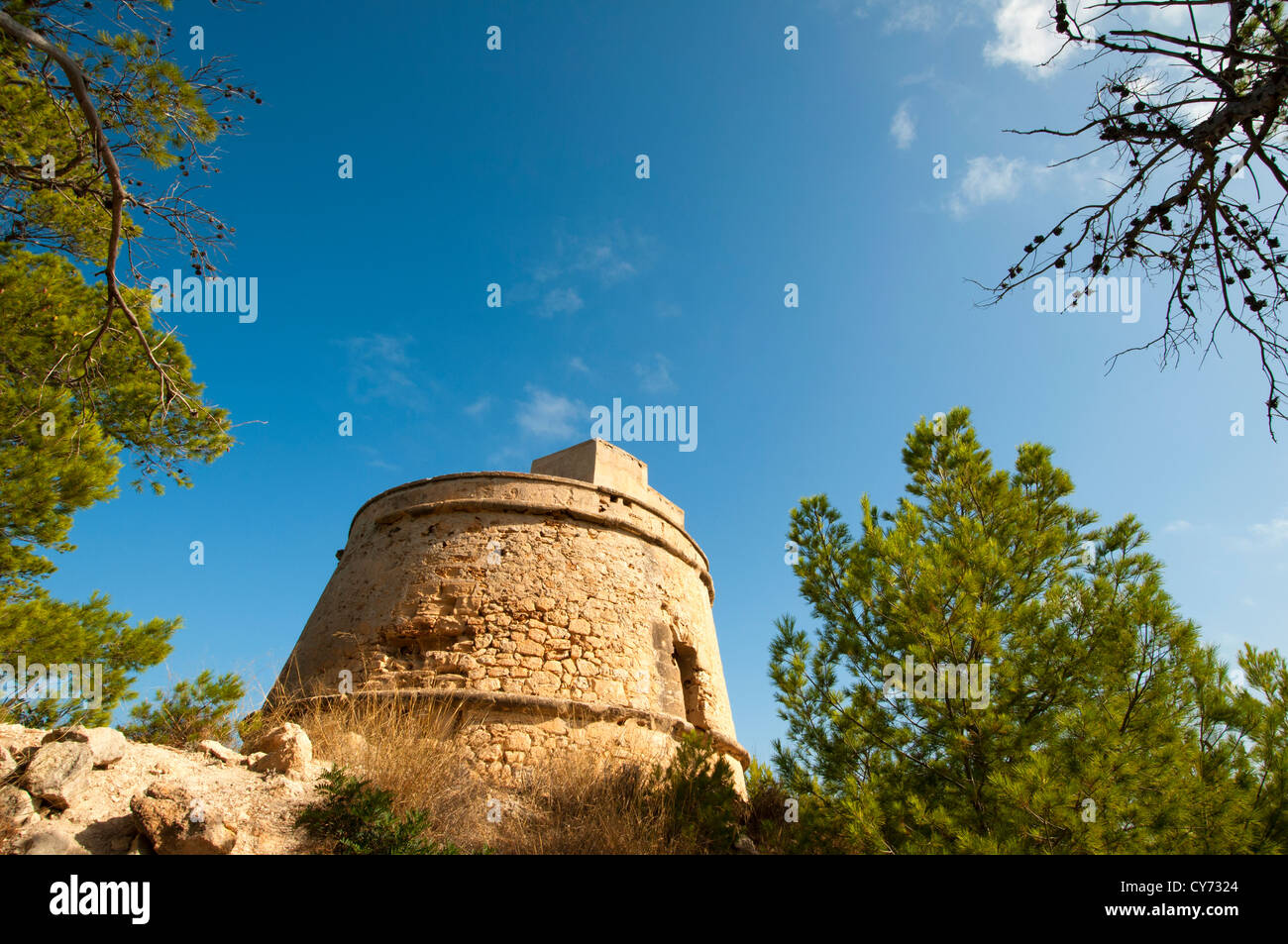 View of Tower Portinaxt, a defensive tower in the coast of Ibiza, Spain. Stock Photo