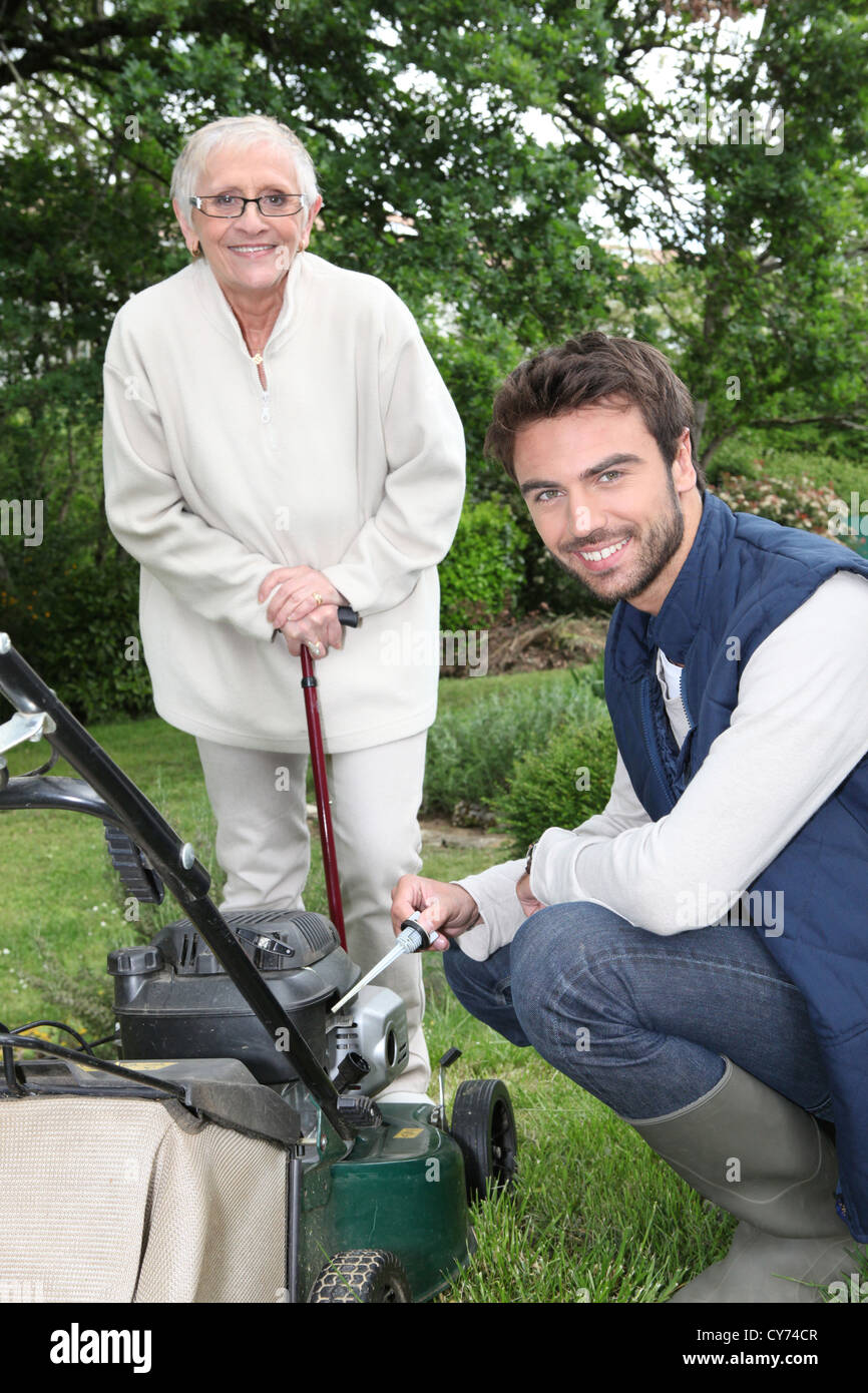 Son helping Mother in the garden Stock Photo - Alamy