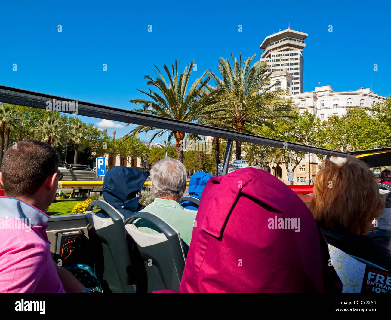 Open top tourist bus used to transport visitors around the city centre in Barcelona Spain Stock Photo