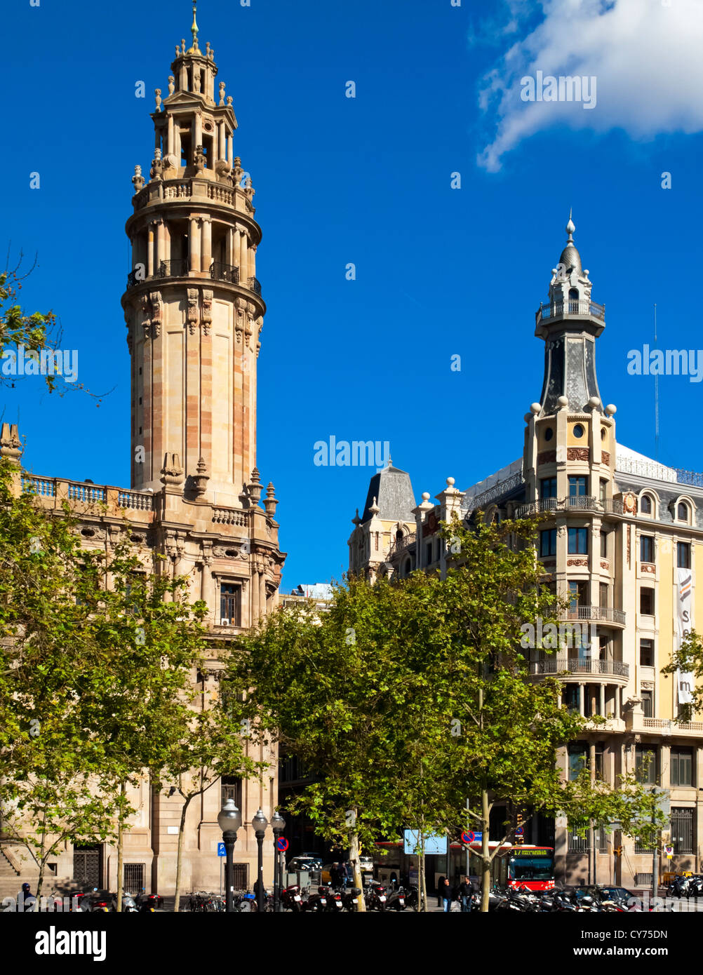 Typical  traditional stone buildings in Barcelona city centre Spain with blue sky and trees Stock Photo