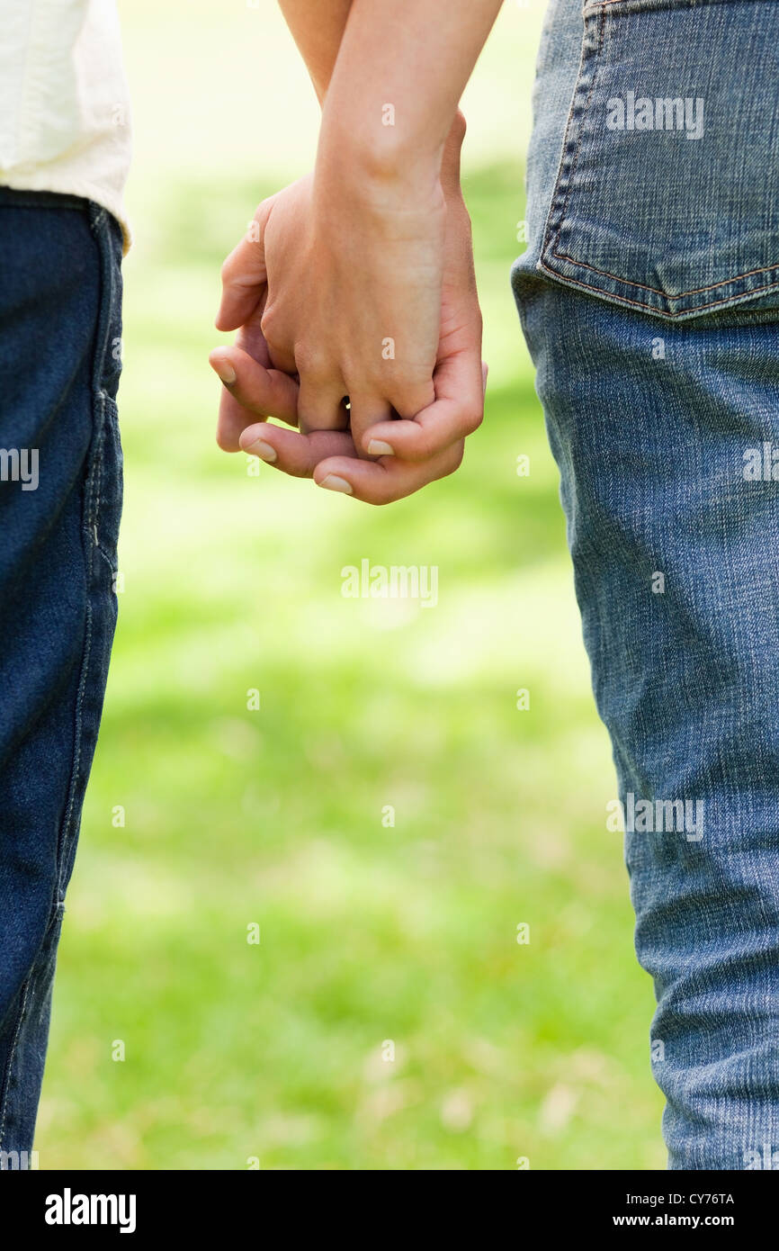 Two friends holding hands Stock Photo