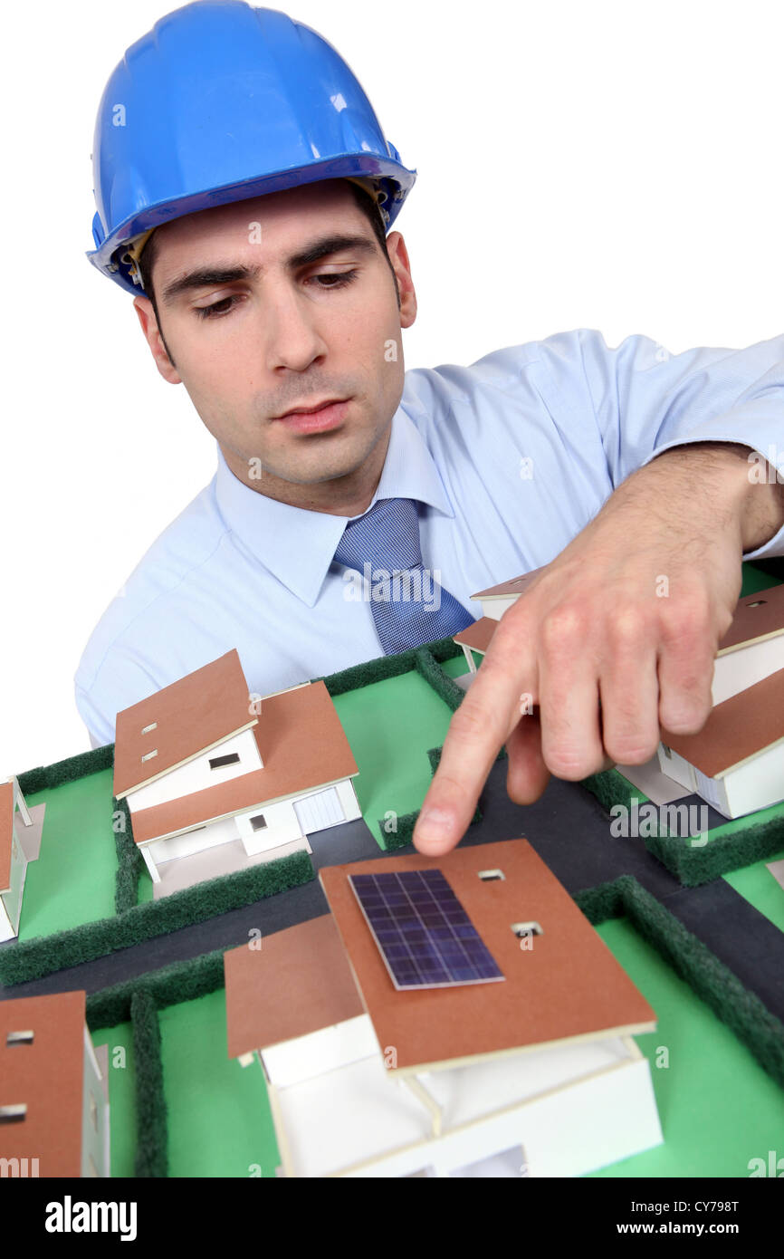 Architect pointing to solar panel Stock Photo - Alamy