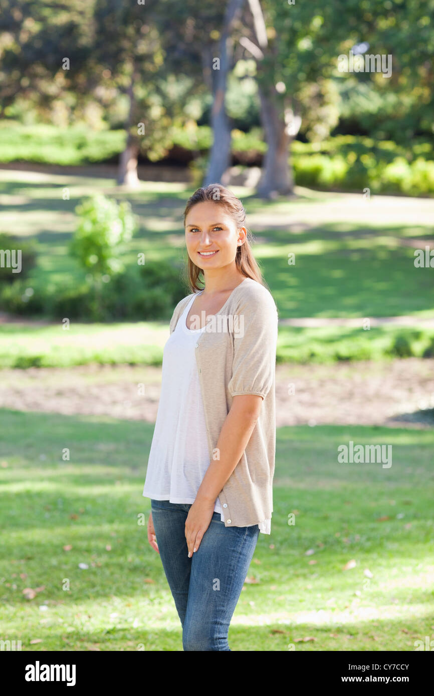 Smiling woman in the park Stock Photo - Alamy