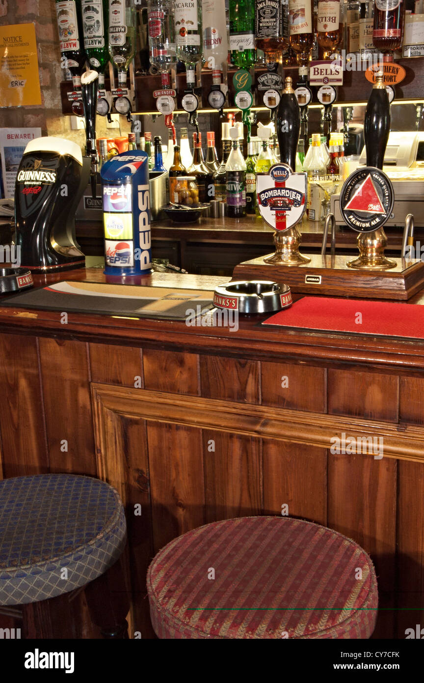 a bar and beer pumps at the sunriser pub Stock Photo Alamy