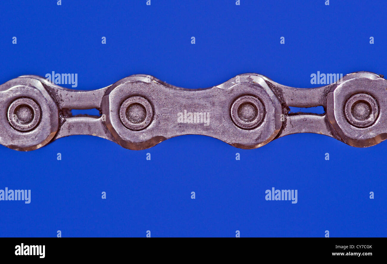 bicycle sprocket chain on blue background Stock Photo Alamy