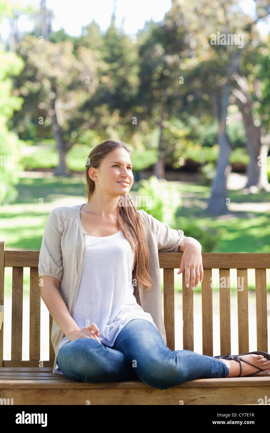 Woman relaxing on a park bench