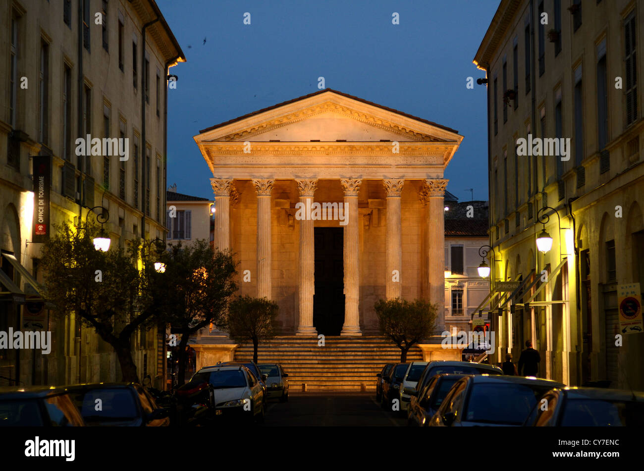 The Maison Carrée or Roman Temple Lit at Night or at Dusk Nimes Gard France Stock Photo