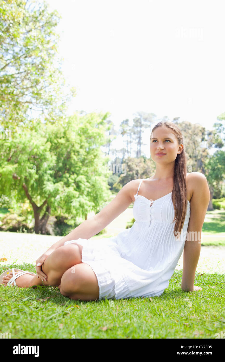 Woman relaxing on the lawn in the park Stock Photo - Alamy