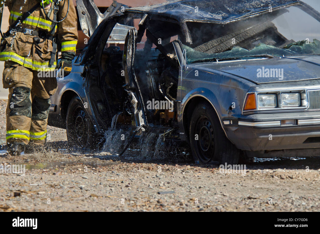 Car that was on fire has been taken care of by firemen. Arizona. Stock Photo