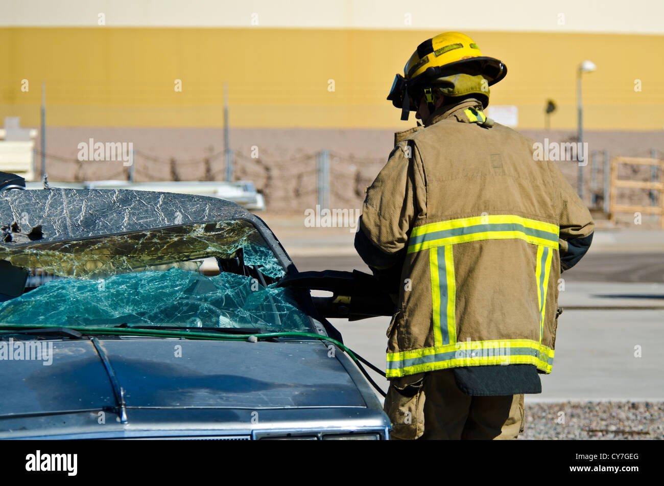 Firemen using the Jaws of Life at a car wreak. Tempe, AZ. Stock Photo