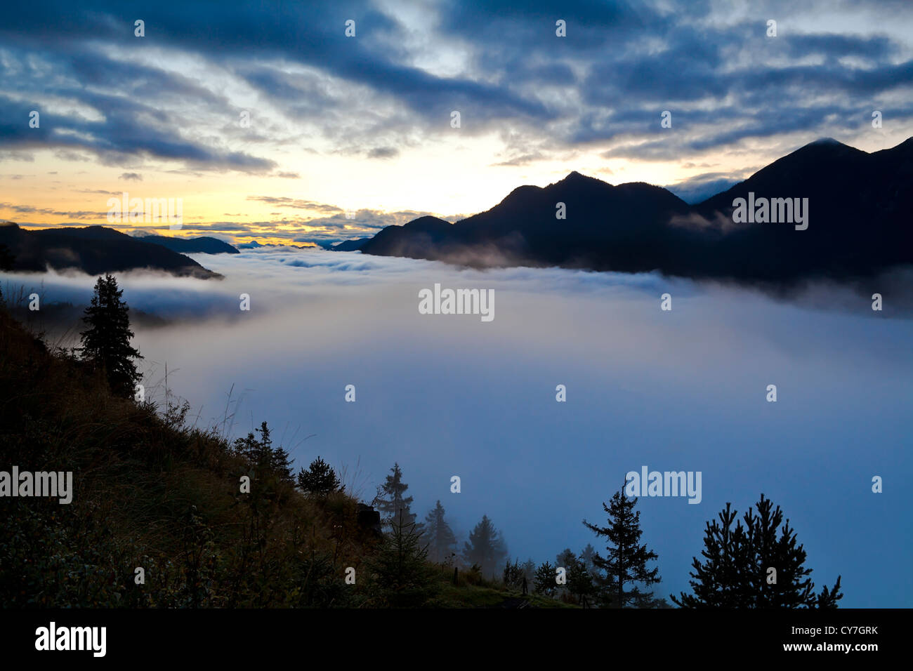 early misty sunrise in Alps, Bavaria Stock Photo