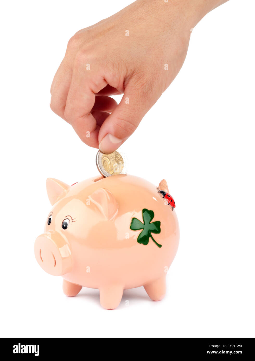 Woman putting coin in piggy bank isolated on white Stock Photo - Alamy