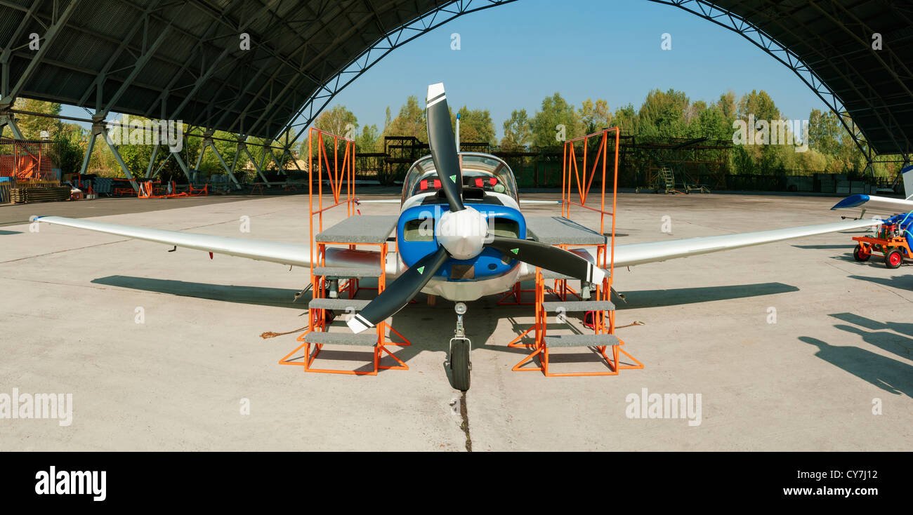 The light four-seat airplane for business and training - front view. Stock Photo