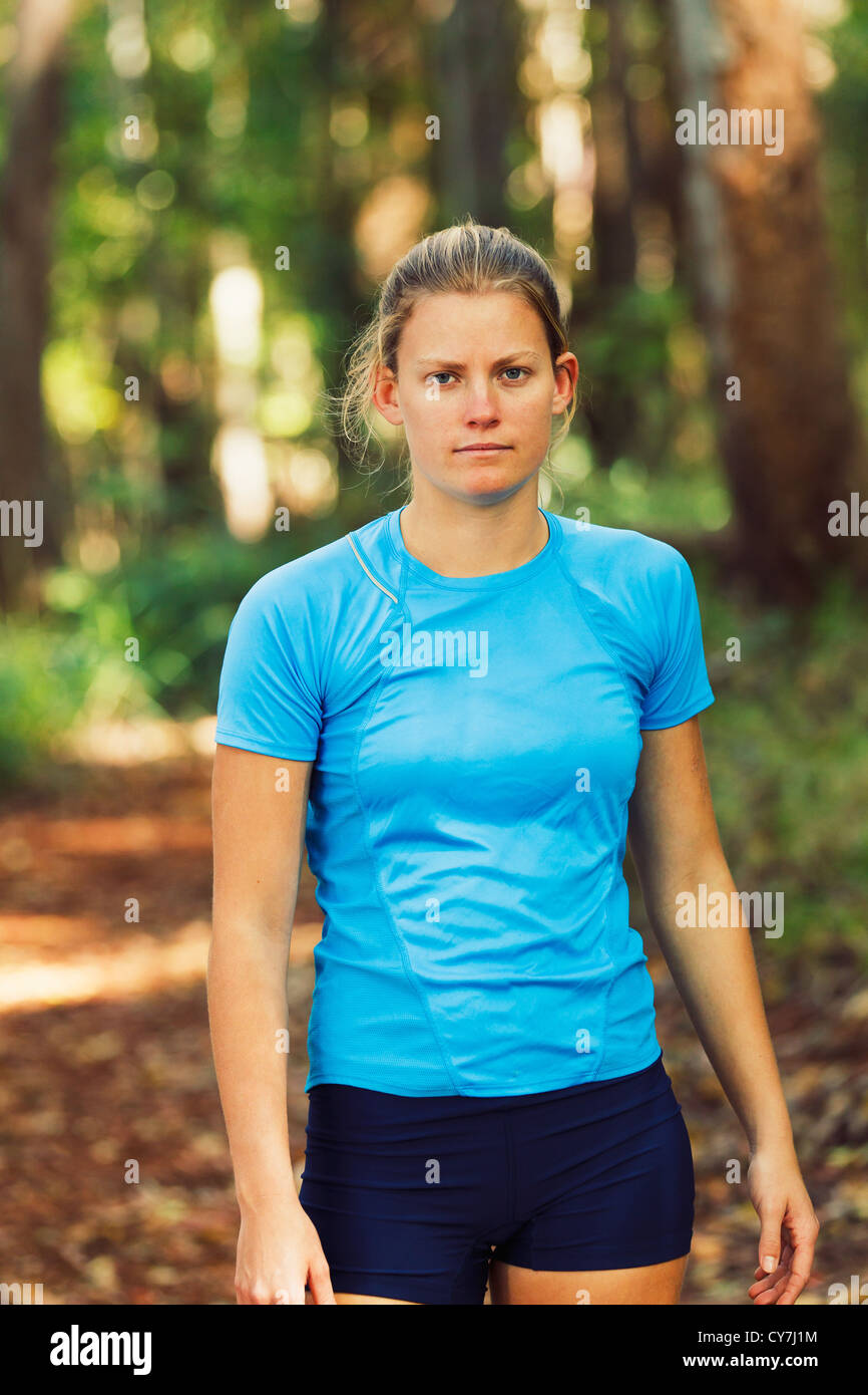 Young Woman Stretching after a Run in the Forest Stock Photo Alamy
