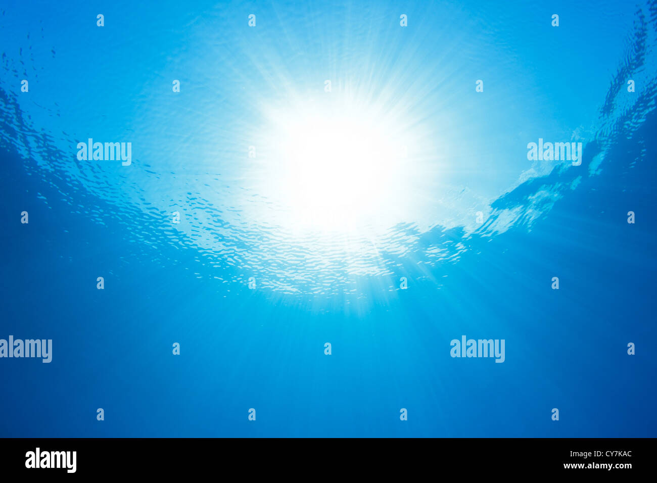 sun rays shining down, sea and ocean underwater scene Stock Photo