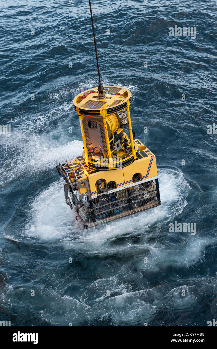 ROV, remotely operated vehicle being launched in the sea Stock Photo
