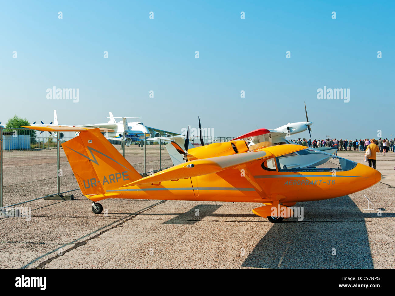 Light two-engine airplane for cruising and training on yellow colour. Stock Photo