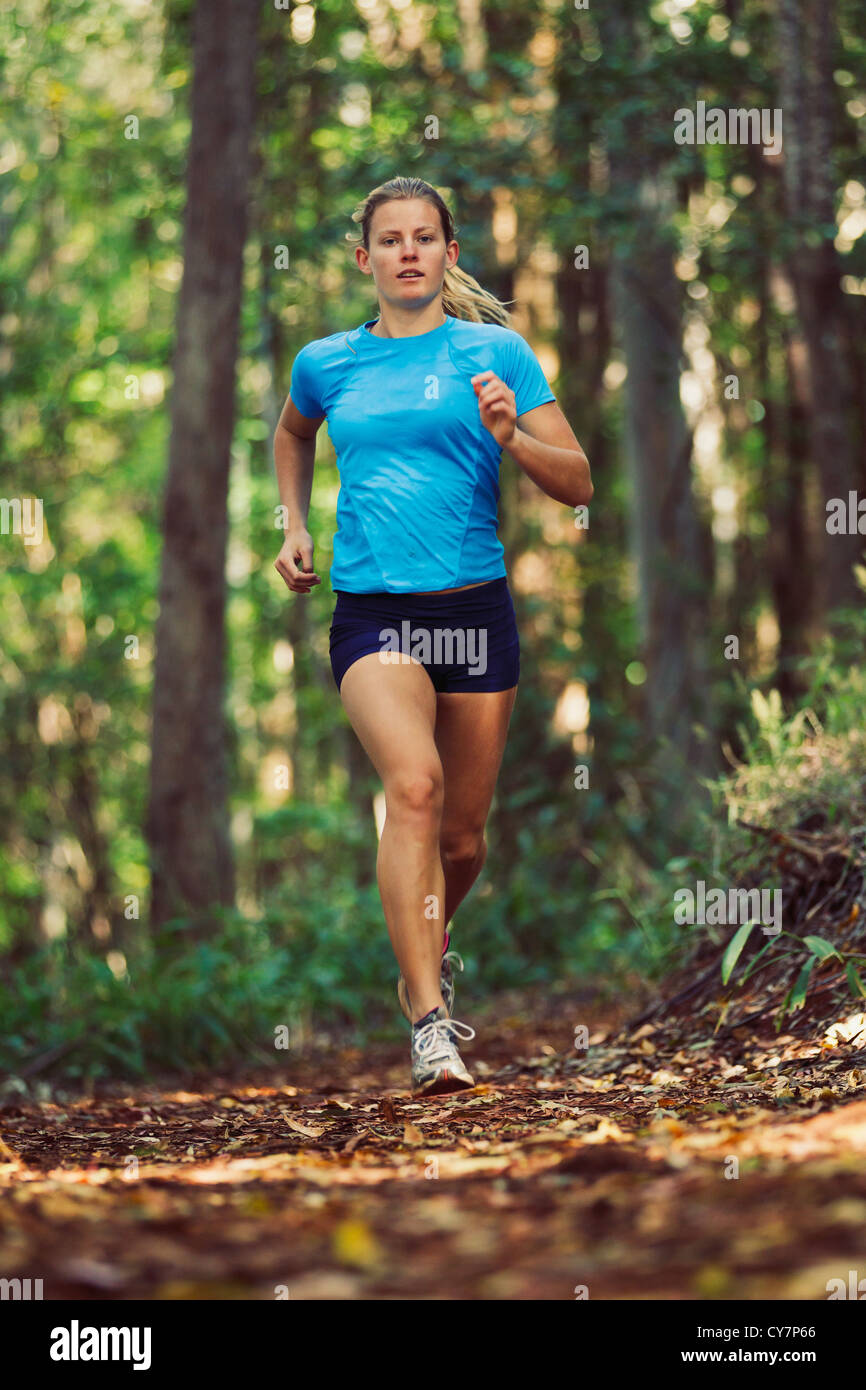 Woman Running Outdoors in Forest Stock Photo - Alamy