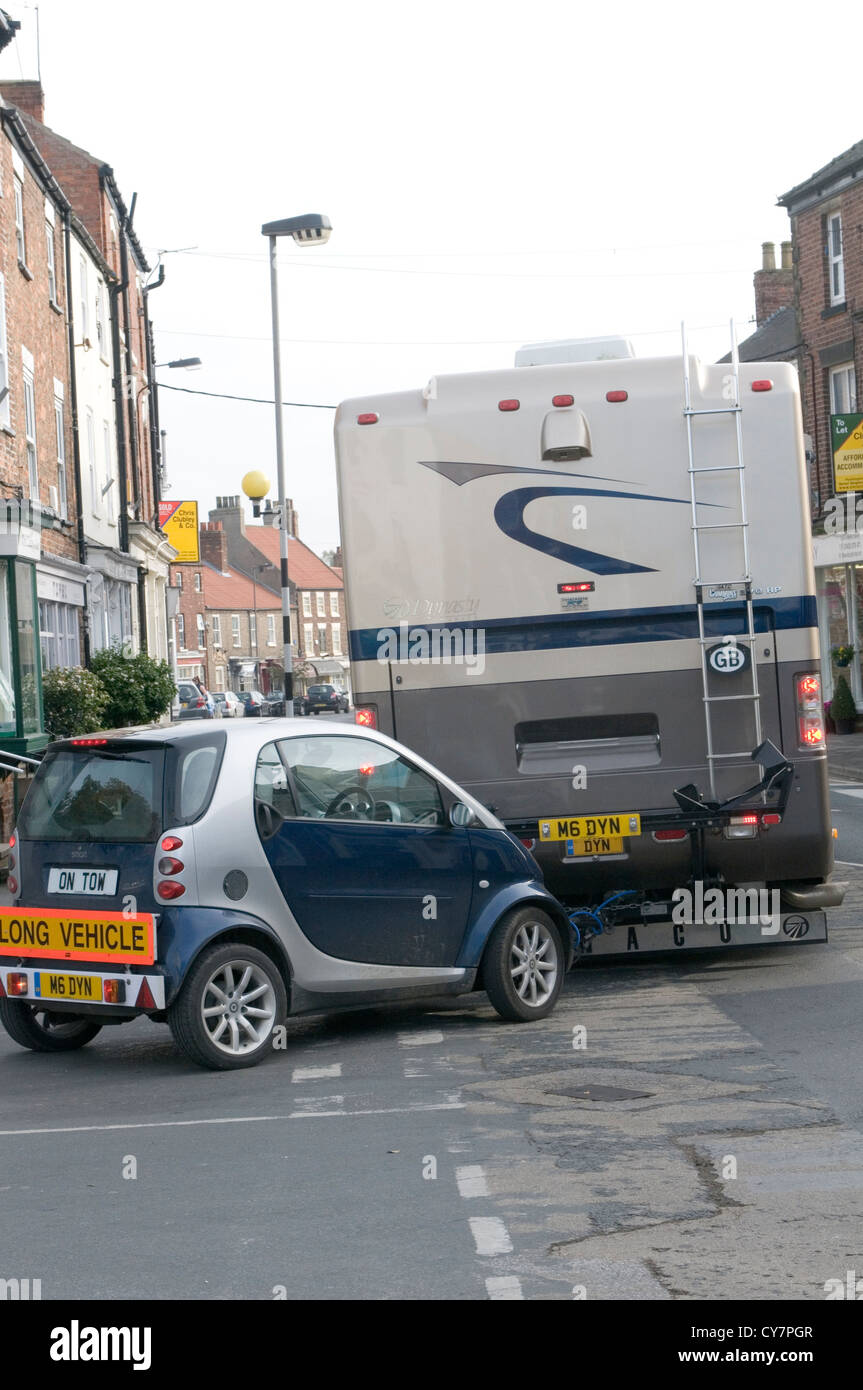 smart car on tow behind an RV recreational Vehicle campervan camper