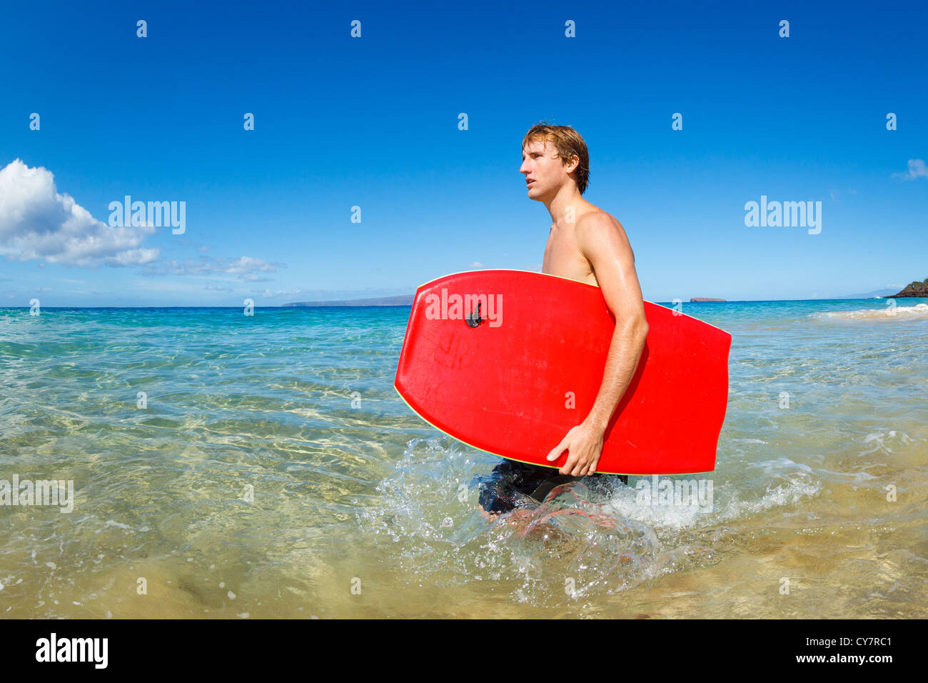 Young Man with Boogie Board at the Beach Stock Photo - Alamy