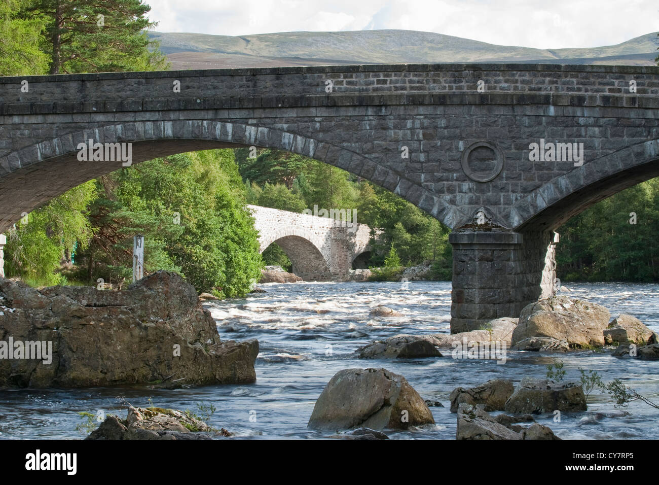 Old Brig O' Dee bridge. Over the River Dee downstream of Braemar in Aberdeenshire, Scotland Stock Photo