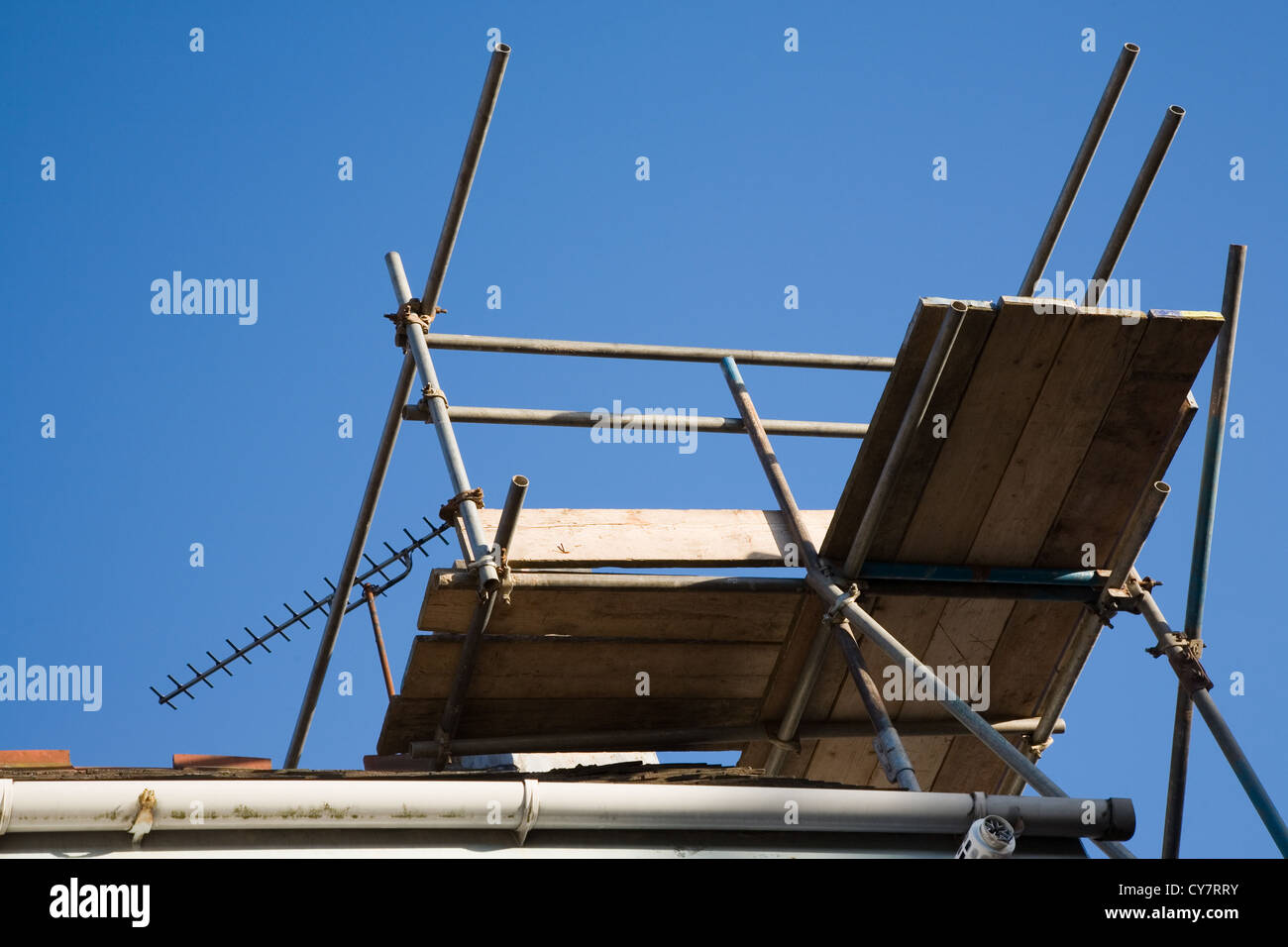 Scaffolding around chimney on house Stock Photo - Alamy