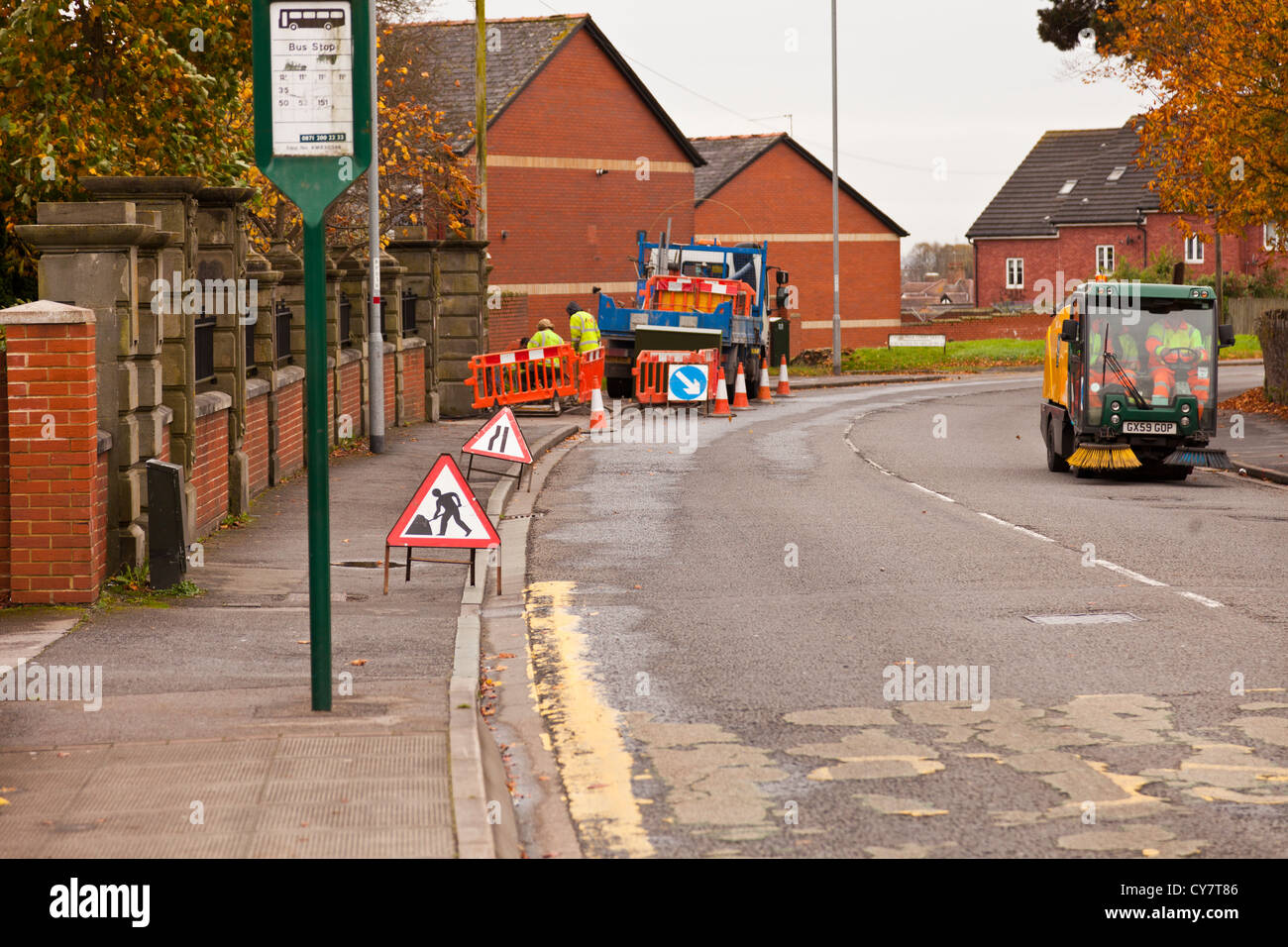 Road works being carried out on bend of main road. Stock Photo
