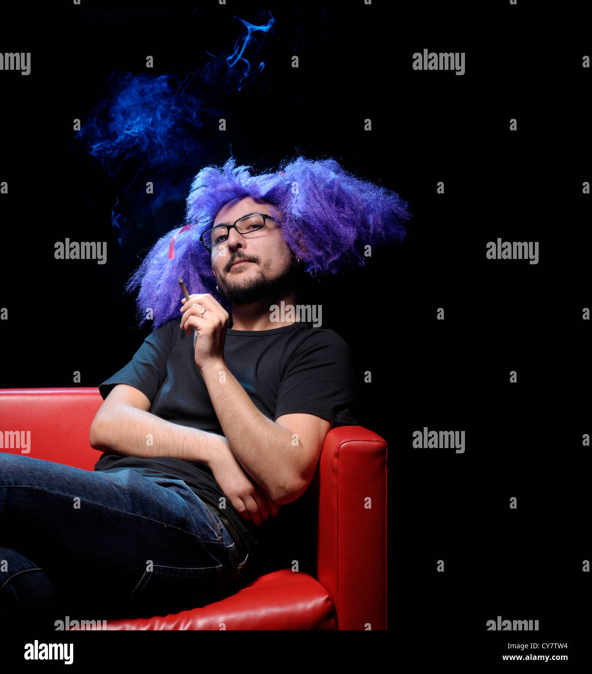 Man with purple wig Stock Photo Alamy