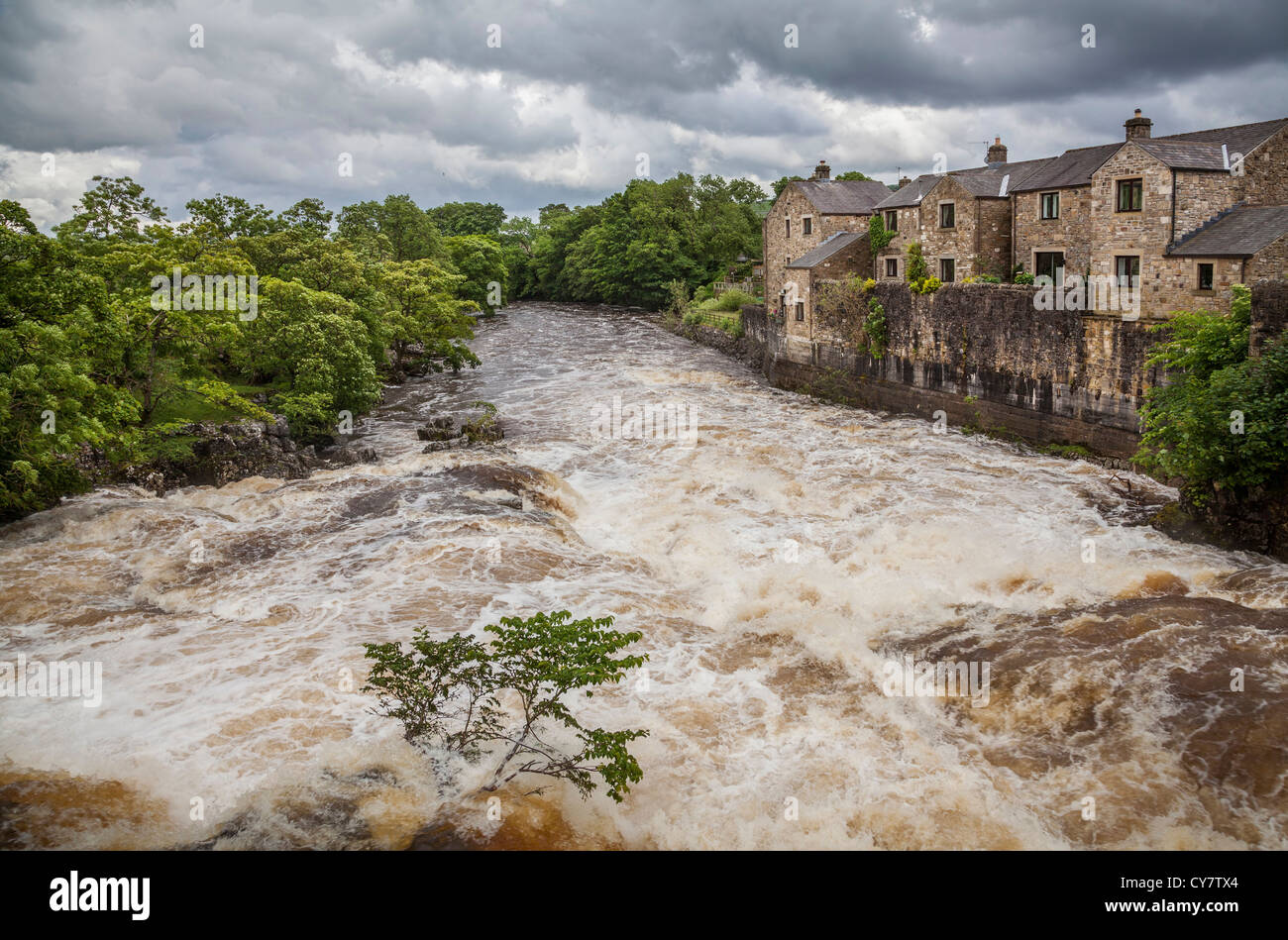 The river Wharf at Linton Falls after heavy rain, North Yorkshire. Stock Photo