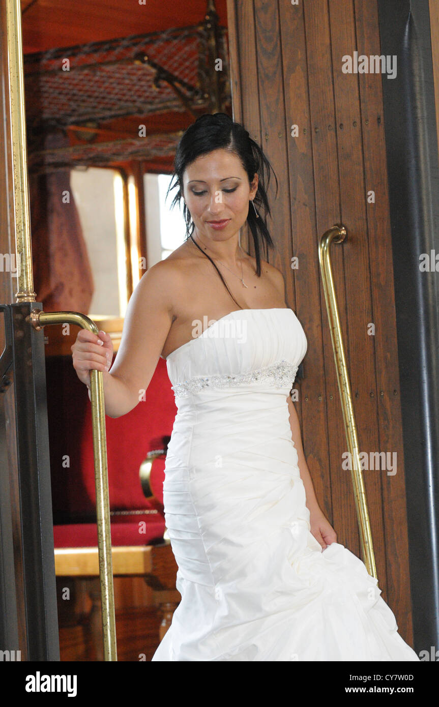 Woman descends from old train Stock Photo