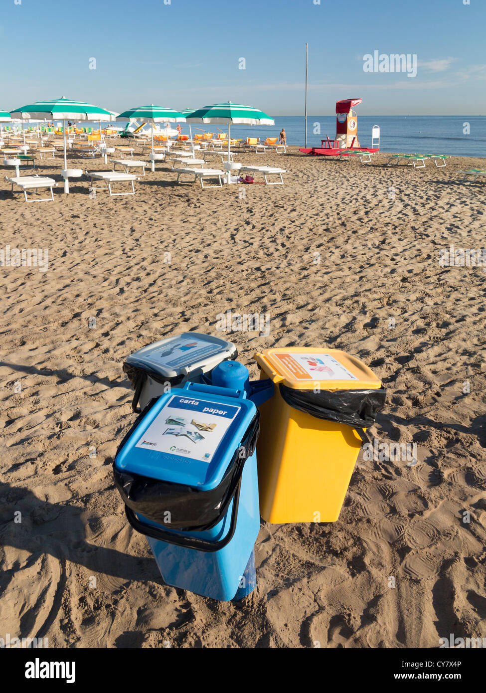 Recycling bins on a beach in Italy Stock Photo