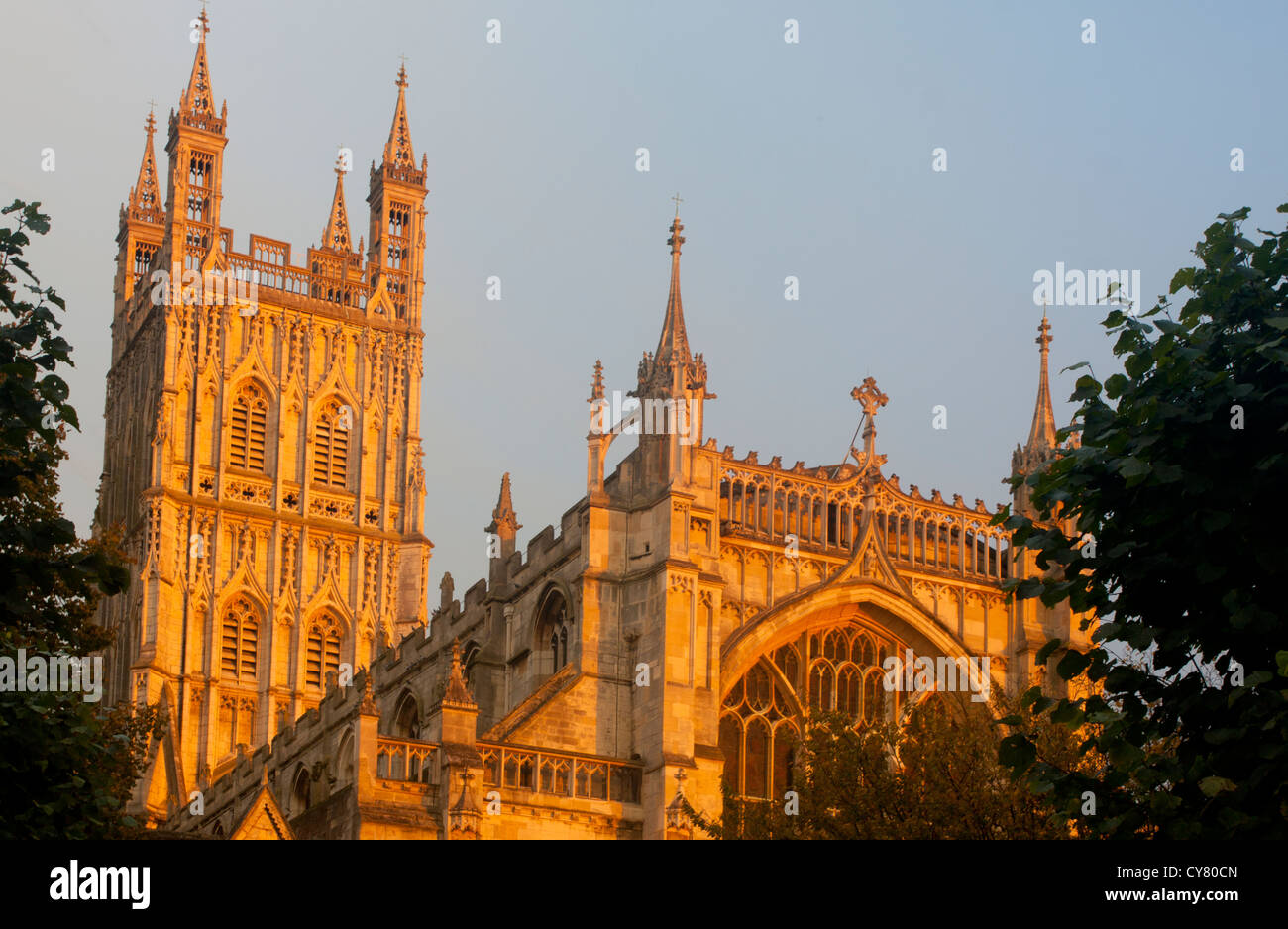 Gloucester Cathedral Central tower and west front at sunset Gloucester Gloucestershire South West England UK Stock Photo