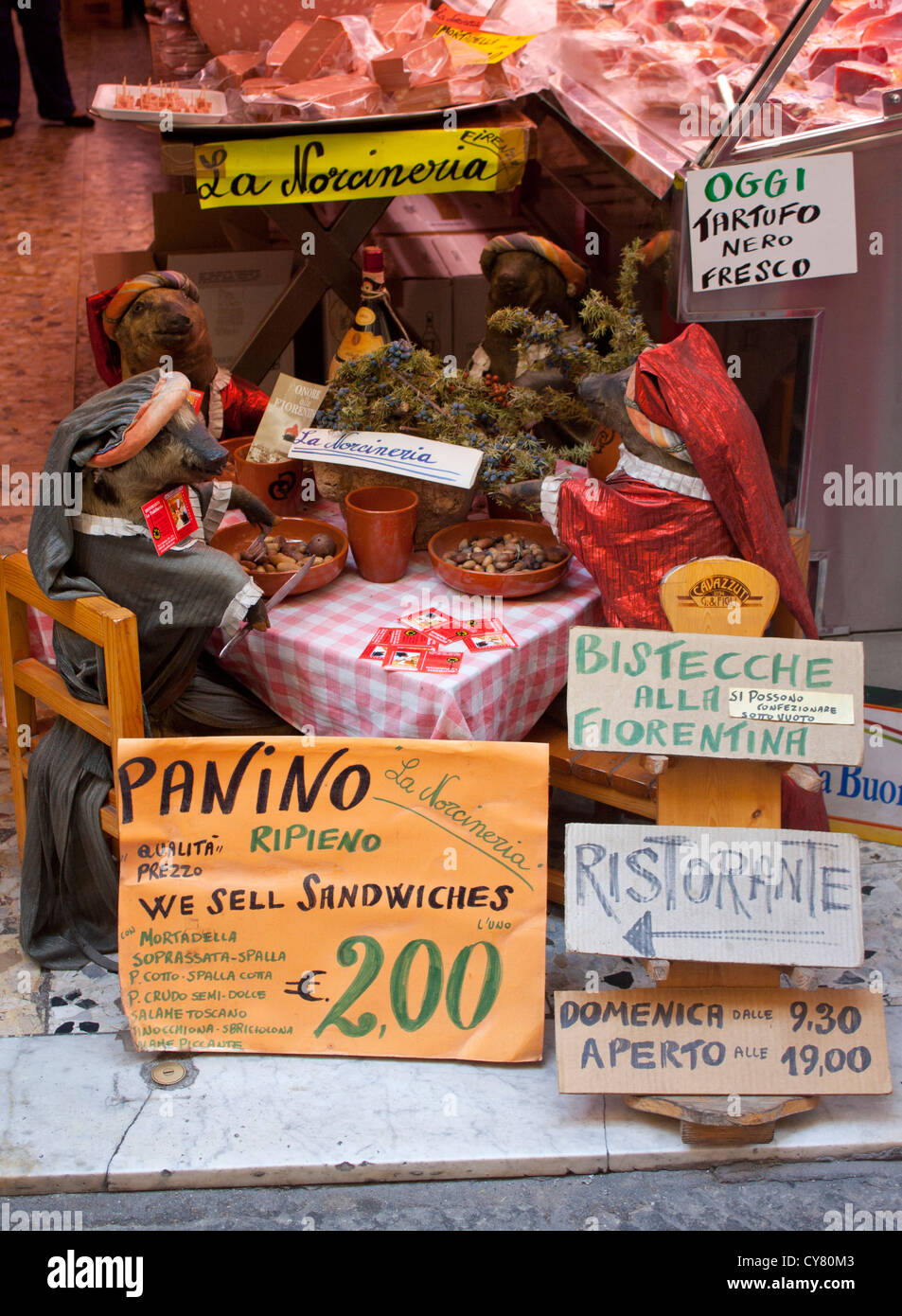 La Norcineria delicatessen and restaurant with table set for four stuffed (and dressed) piglets Florence Firenze Tuscany Italy Stock Photo