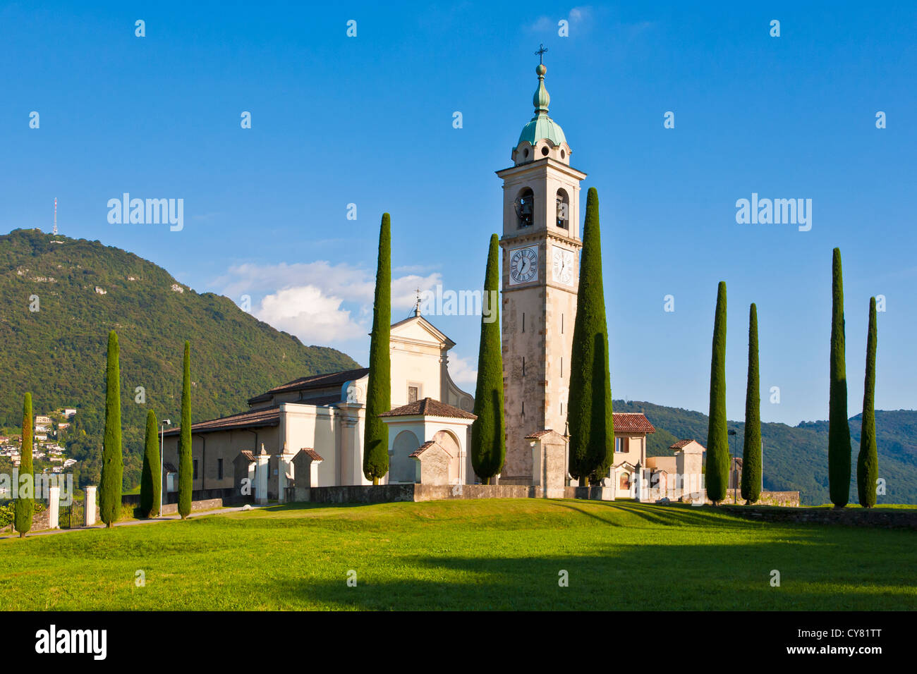 ALLEY OF CYPRESSES, SANT ABBONDIO CHURCH IN GENTILINO, NEAR MONTAGNOLA, LUGANESE, TICINO, SWITZERLAND Stock Photo