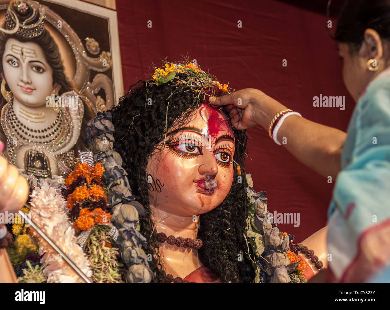 Bengali Woman hindu devotee offering Godess Durga on the traditional festival of Bijoya Dasami, Dussehra, Calcutta, India  Stock Photo