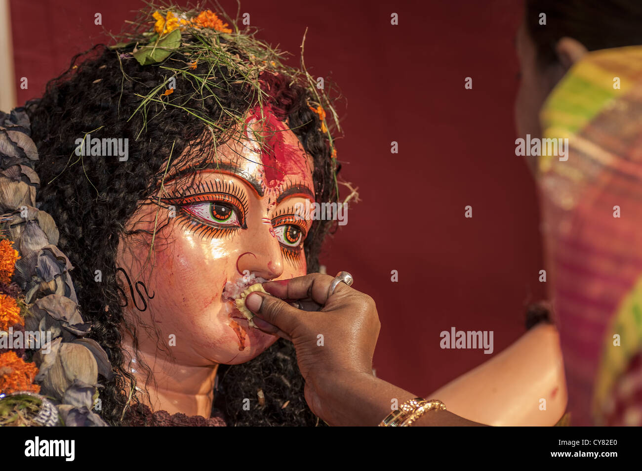 Bengali Woman hindu devotee offering Godess Durga on the traditional festival of Bijoya Dasami, Dussehra, Calcutta, India  Stock Photo