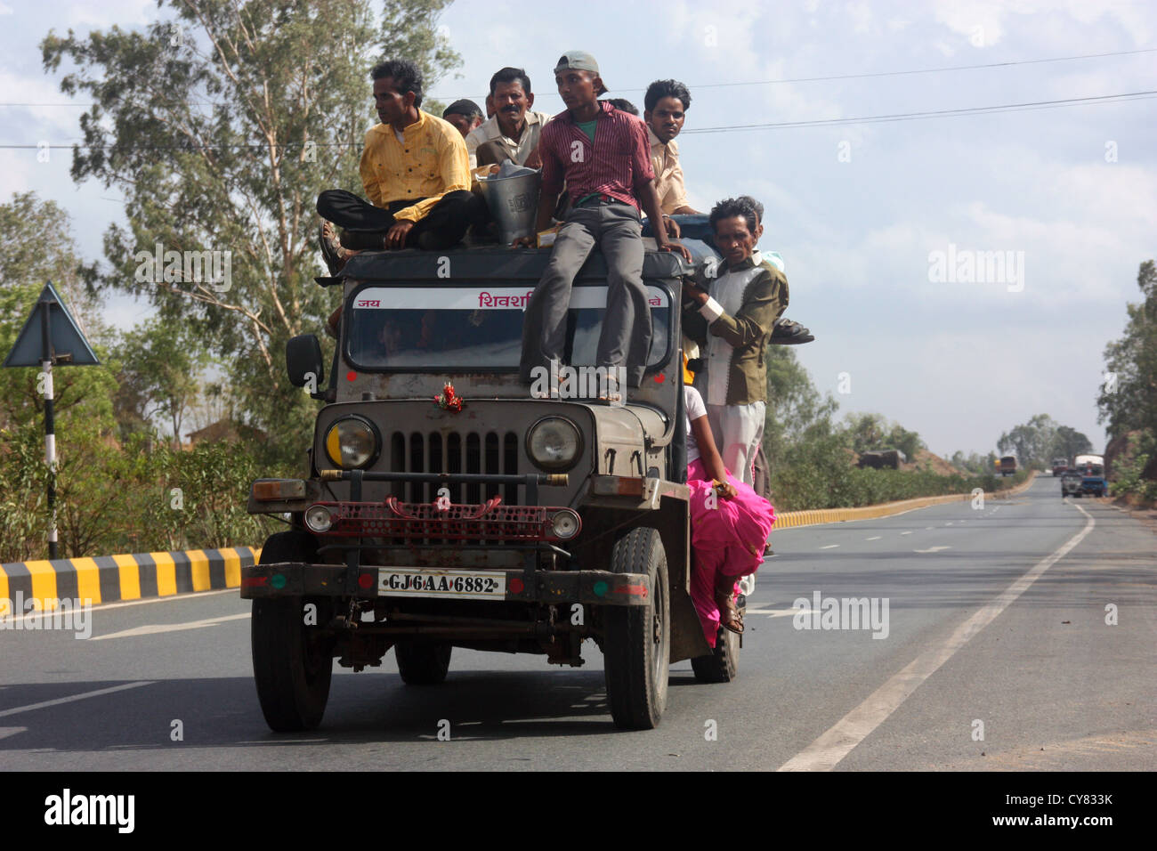 Overloaded Indian jeep taxi on Rajasthan, highway Stock Photo