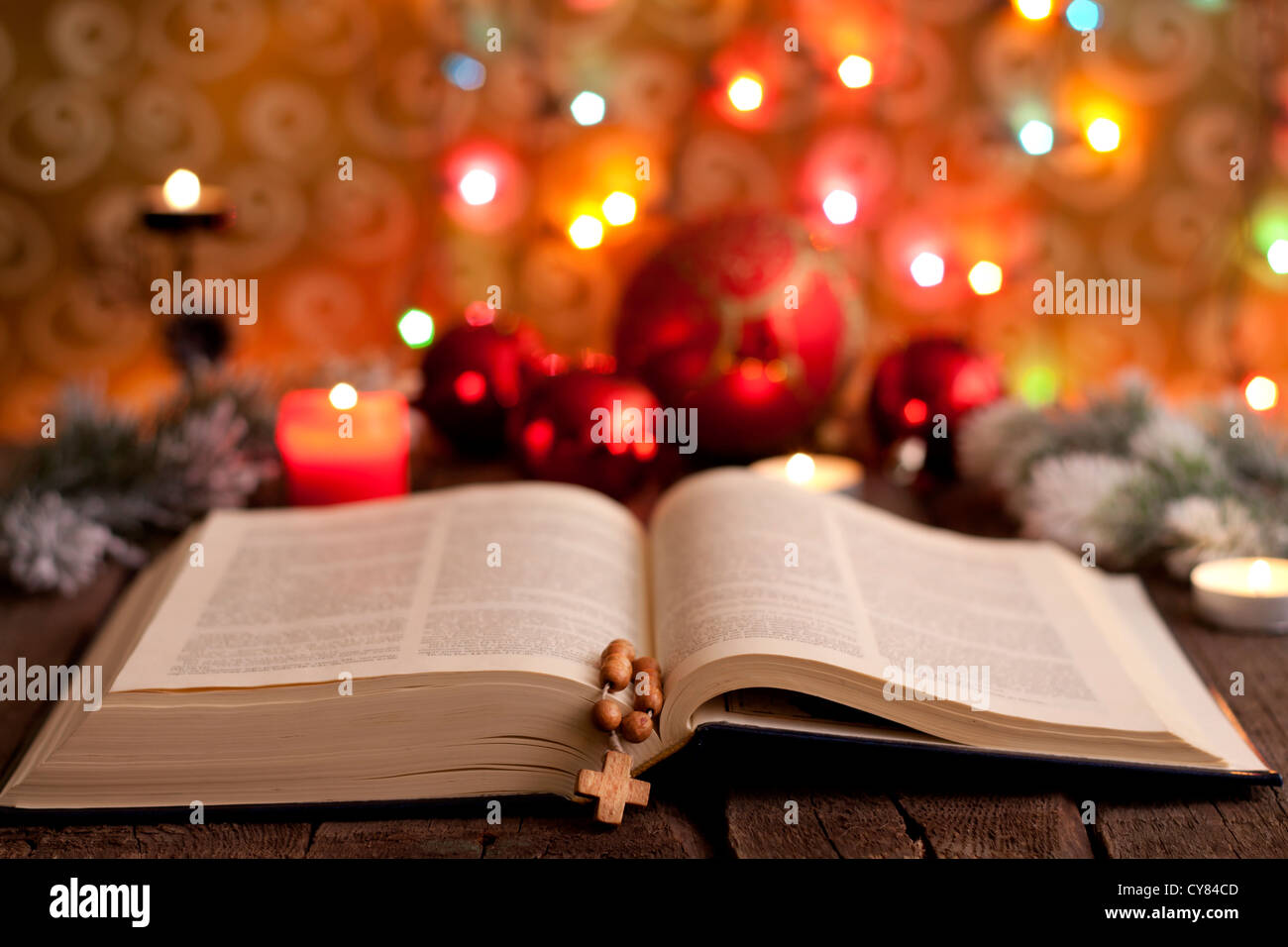 Christmas and bible with blurred candles light background Stock Photo