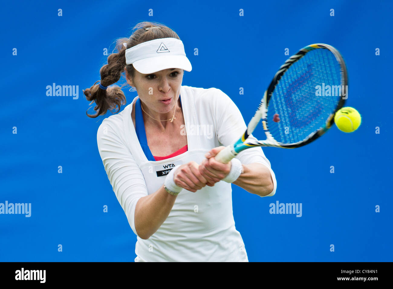 Galina Voskoboeve in action playing double handed back hand. Stock Photo