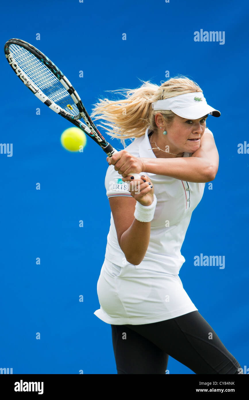 Aleksandra Wozniak in action playing double handed back hand during match. Stock Photo