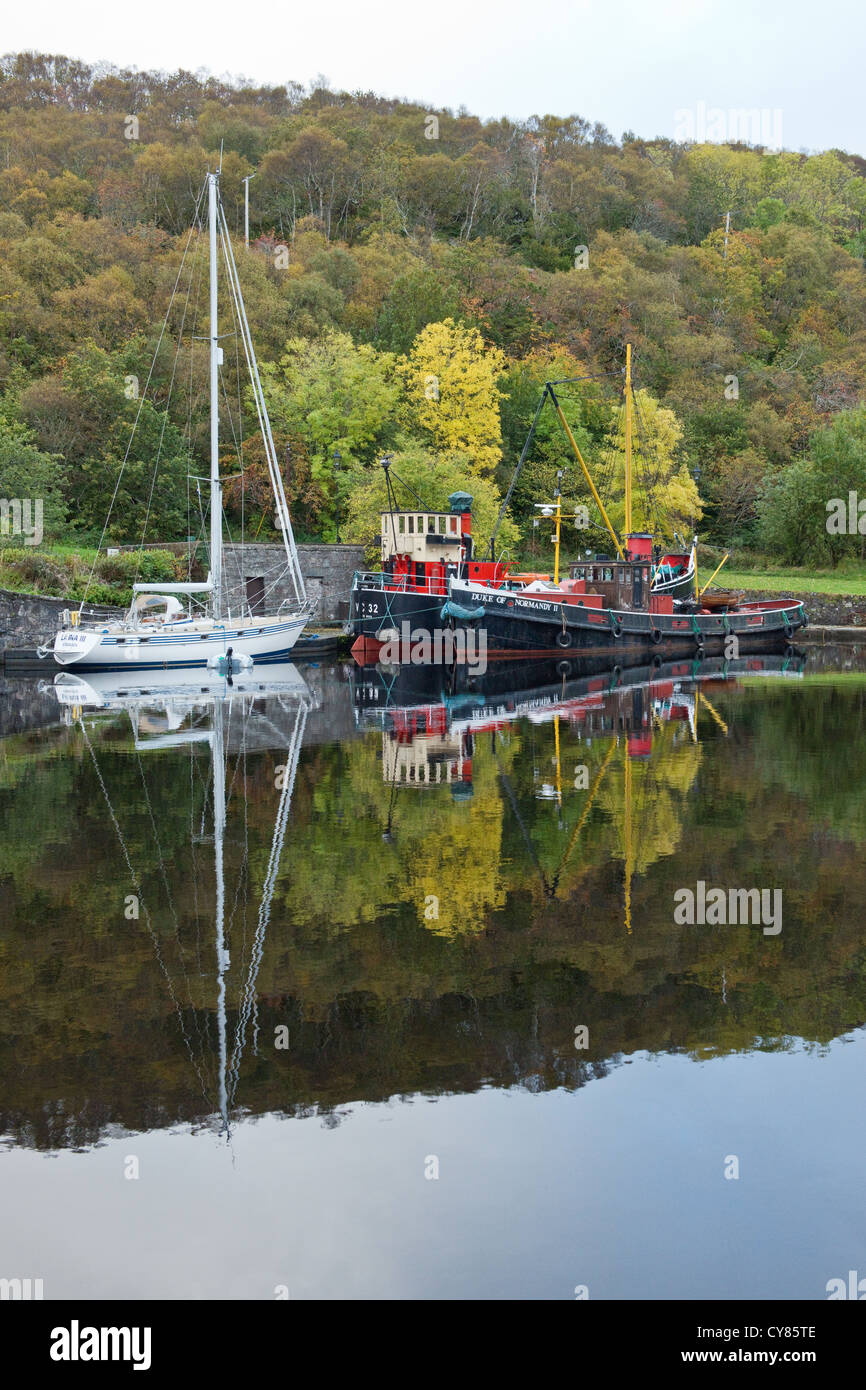 Yacht and historic inshore cargo boat in the Crinan Canal in ...