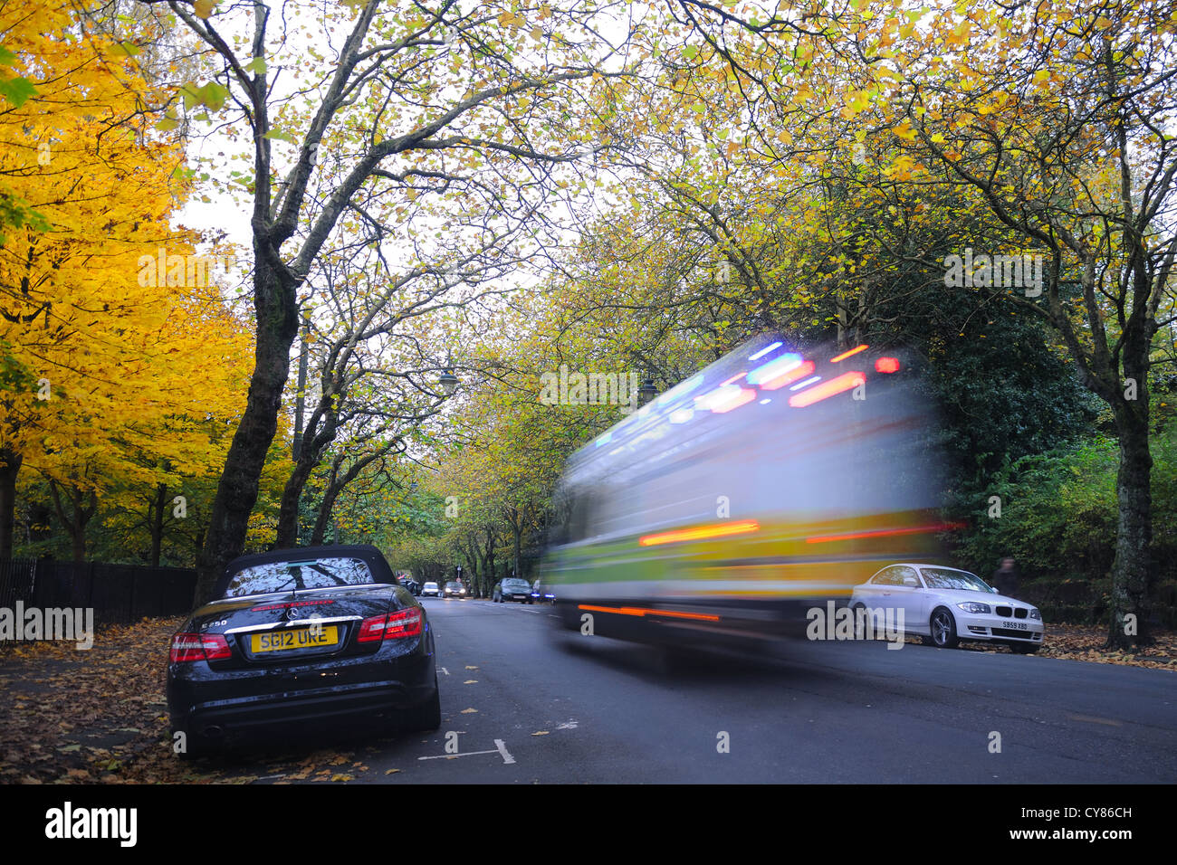 A blurred police vehicle speeds to an incident in Glasgow, Scotland. Stock Photo
