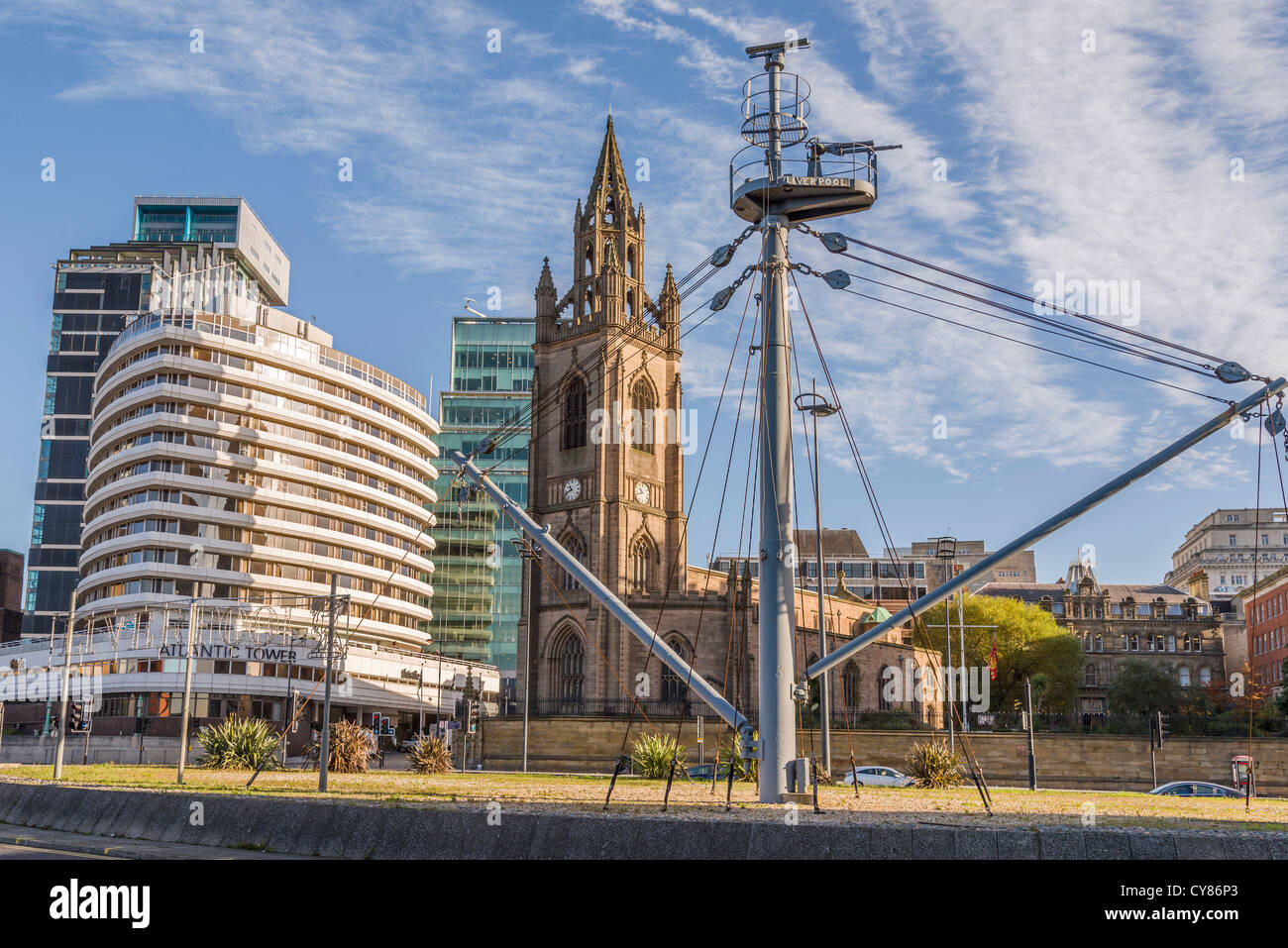 St. Nicholas' parish church at Liverpool pierhead,known as the sailors church with the Atlantic Tower hotel to the left. Stock Photo