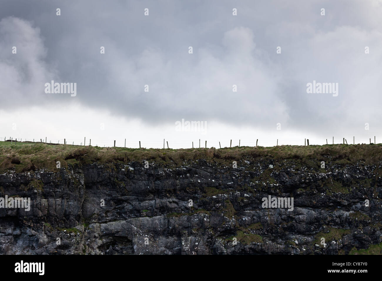 Fence against stormy sky, Northern Ireland Stock Photo Alamy