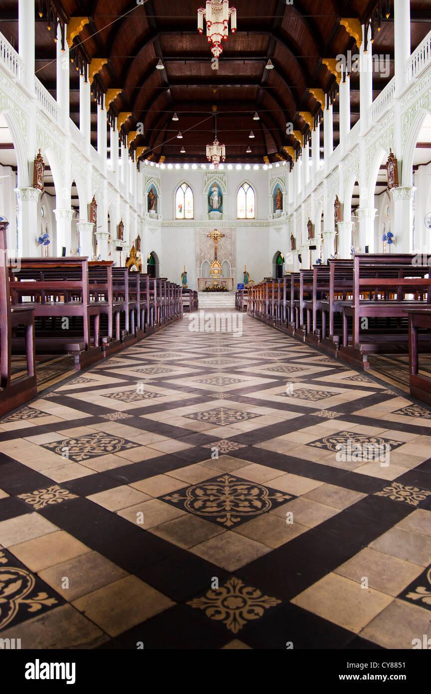 An aisle between rows of seats in a church Stock Photo Alamy
