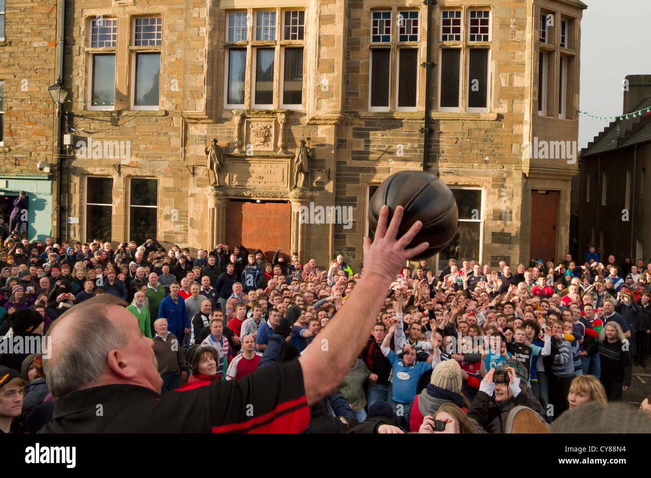 Throwing in the ball, New Year Ba game, Kirkwall Stock Photo
