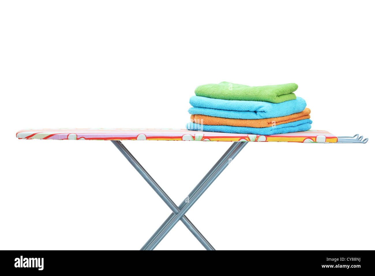 Ironing board with towels isolated on white background Stock Photo Alamy