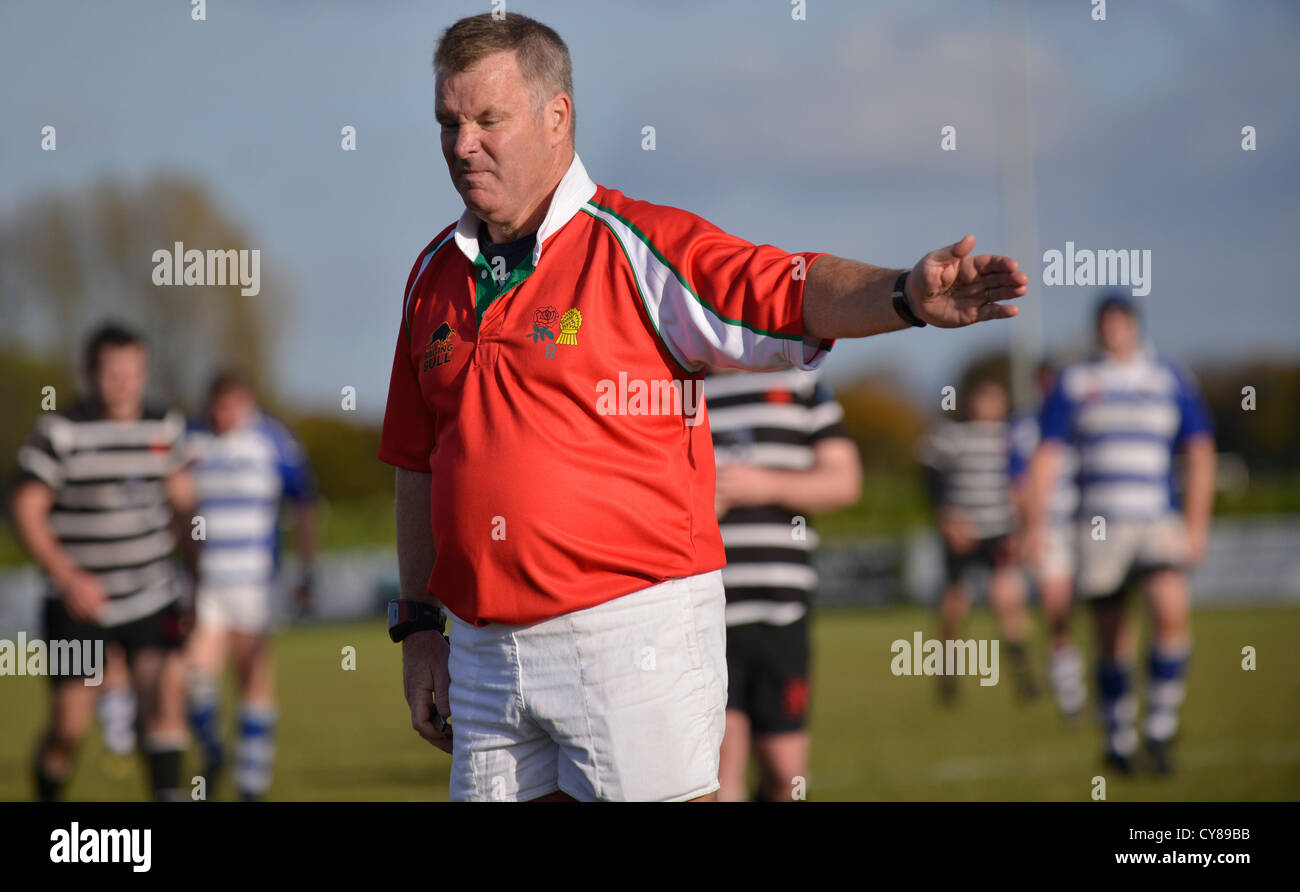 rugby referee pointing during a match between Broughton Park and Tyldesley Stock Photo