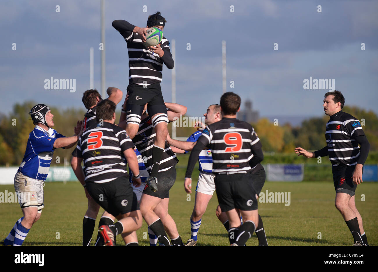 player catches the ball at a line-out  from a rugby match between Broughton Park andTyldesley Stock Photo